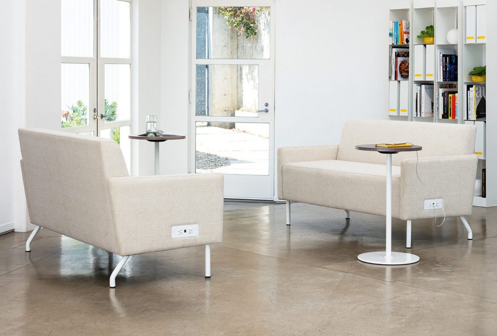 Intima Love Seats with Power units alongside pull-up tables