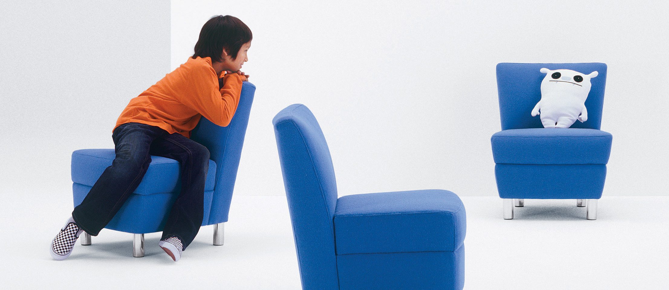 Serafinita Lounge Chair with child sitting on one